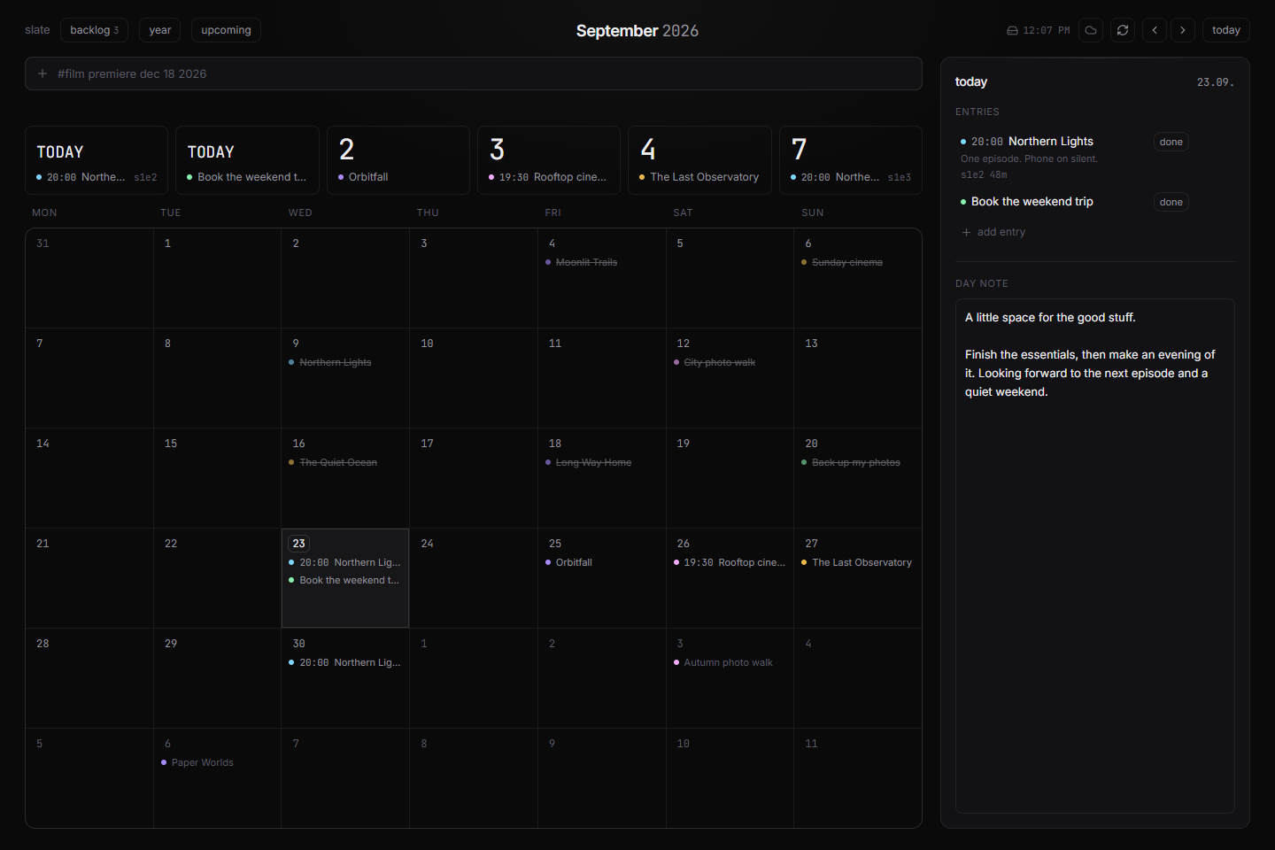 Slate month calendar with countdowns, scheduled entries, and a daily note